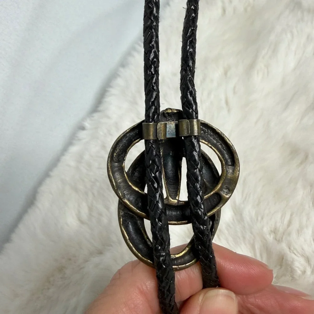 Vintage Western Bolo Tie Antique Brass Intertwined Rings Black Braided Cord